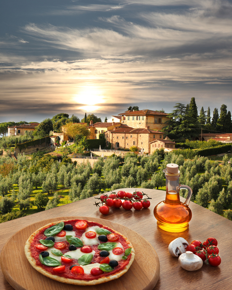 Italian pizza against villa  in Tuscany, Italy